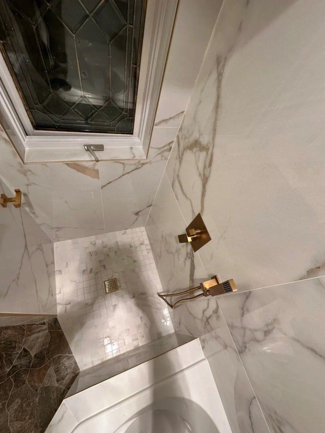 Finished marble-look tile shower