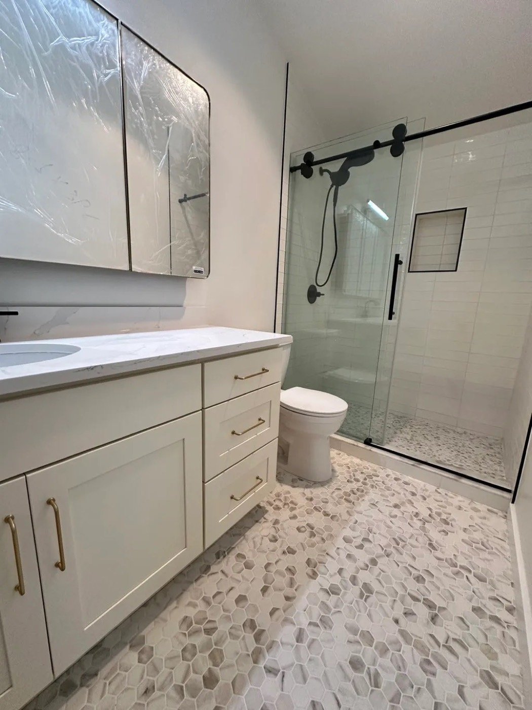 Bathroom with glass shower and vanity