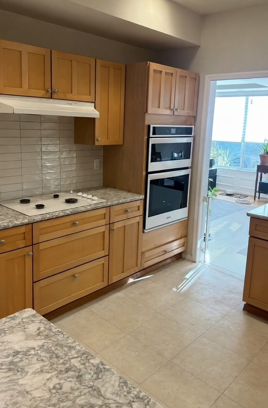 Kitchen with new tile backsplash