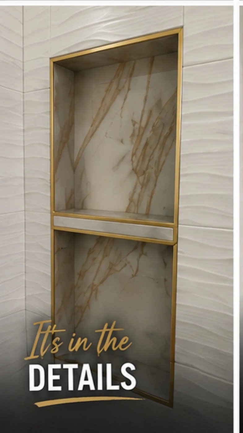 Marble-look shower niche finished with brass Schluter trim